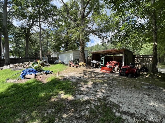 102 Mechams Cove Rd, Topping, VA 23169 - view of yard featuring an outdoor structure and an outbuilding
