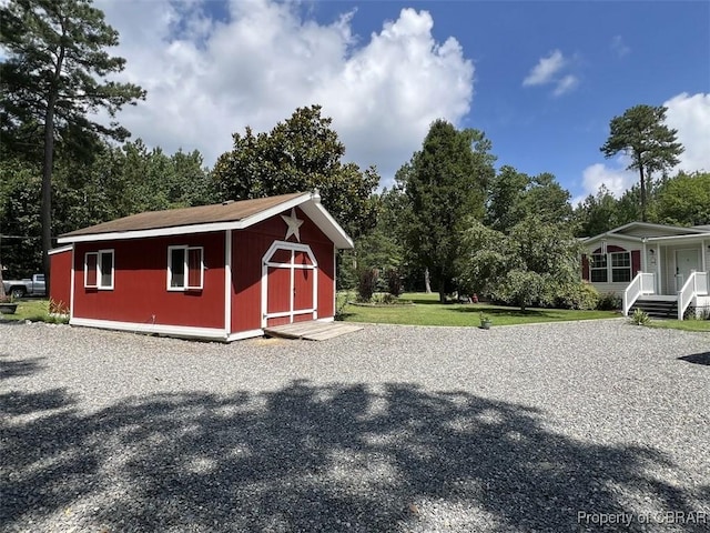 102 Mechams Cove Rd, Topping, VA 23169 - view of shed with view of scattered trees