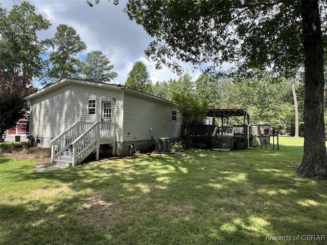 102 Mechams Cove Rd, Topping, VA 23169 - view of property exterior with crawl space, a lawn, a pergola, and a wooden deck