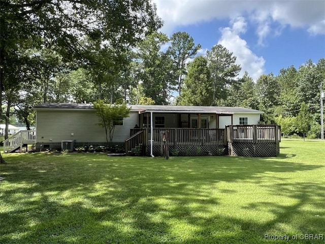 102 Mechams Cove Rd, Topping, VA 23169 - back of property with a yard and a deck