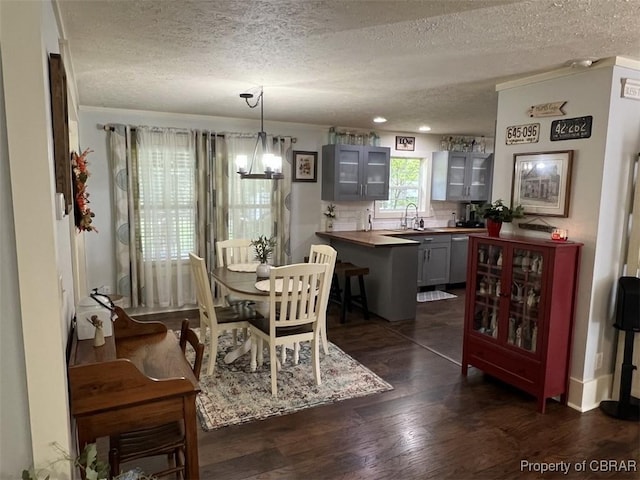 102 Mechams Cove Rd, Topping, VA 23169 - dining area with a textured ceiling, dark wood-style floors, a chandelier, and recessed lighting