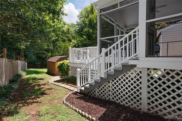 7117 Deer Thicket Dr, Midlothian, VA 23112 - view of yard with stairway, a storage shed, a sunroom, and a wooden deck