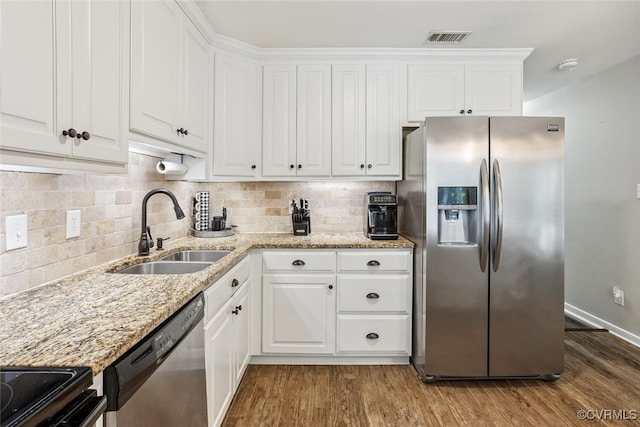 7117 Deer Thicket Dr, Midlothian, VA 23112 - kitchen with appliances with stainless steel finishes, wood finished floors, and white cabinetry