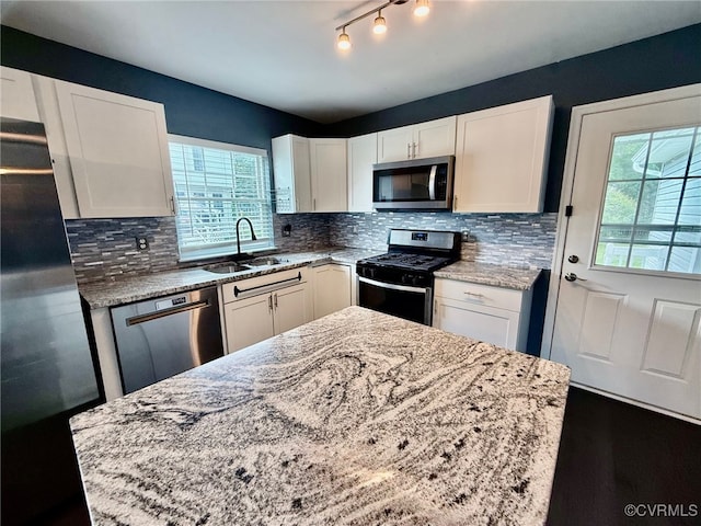 9903 Bethwood Dr, Fredericksburg, VA 22407 - kitchen featuring stainless steel appliances, light stone countertops, white cabinets, and backsplash