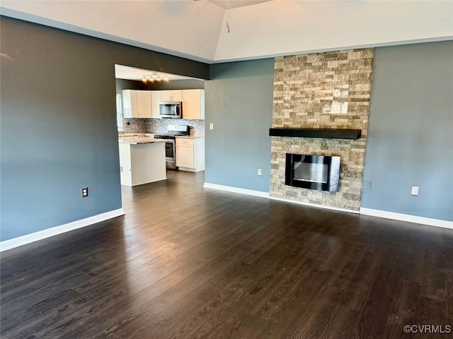 9903 Bethwood Dr, Fredericksburg, VA 22407 - unfurnished living room with dark wood-type flooring and a fireplace