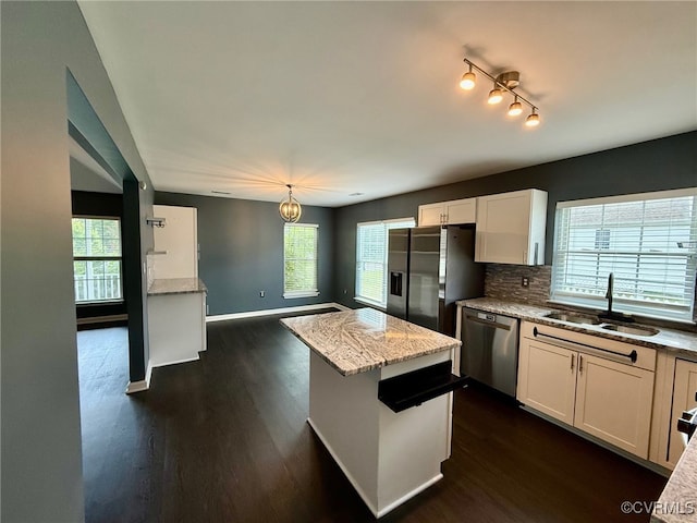 9903 Bethwood Dr, Fredericksburg, VA 22407 - kitchen featuring dark wood-style floors, white cabinetry, light stone counters, stainless steel appliances, and tasteful backsplash