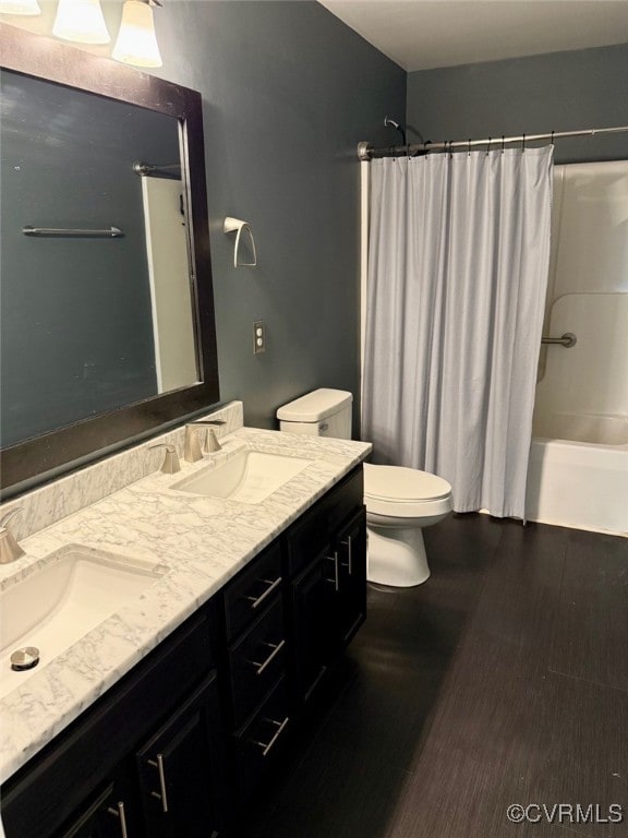 9903 Bethwood Dr, Fredericksburg, VA 22407 - bathroom with double vanity, shower / tub combo, and wood finished floors