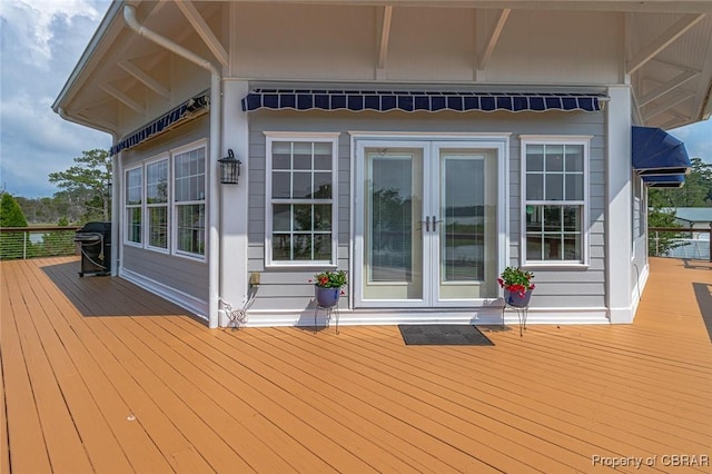 744 Possum Point Rd, Port Haywood, VA 23109 - deck with french doors and a grill