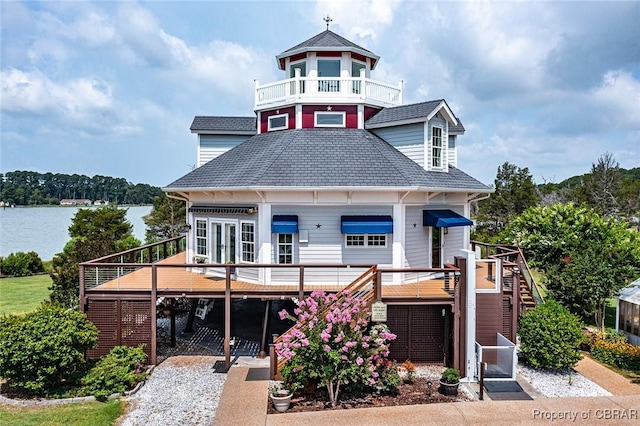 744 Possum Point Rd, Port Haywood, VA 23109 - victorian-style house with stairs, a deck with water view, and roof with shingles