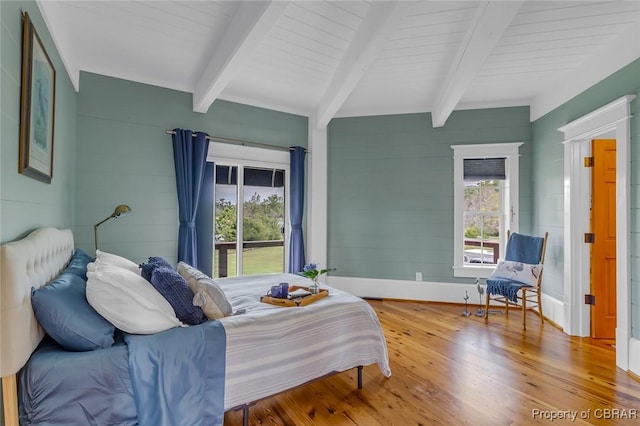 744 Possum Point Rd, Port Haywood, VA 23109 - bedroom featuring beamed ceiling, wood finished floors, and access to outside