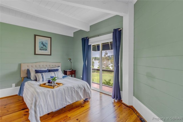 744 Possum Point Rd, Port Haywood, VA 23109 - bedroom featuring beam ceiling, access to outside, wood-type flooring, and wooden walls