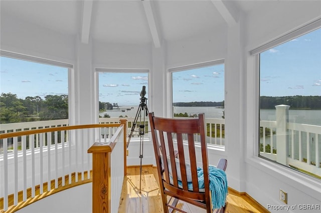744 Possum Point Rd, Port Haywood, VA 23109 - sunroom / solarium featuring beamed ceiling, wood finished floors, and a water view