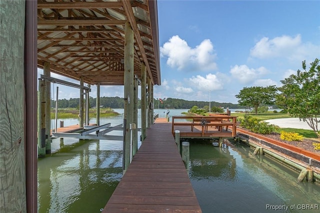 744 Possum Point Rd, Port Haywood, VA 23109 - dock featuring boat lift and a water view