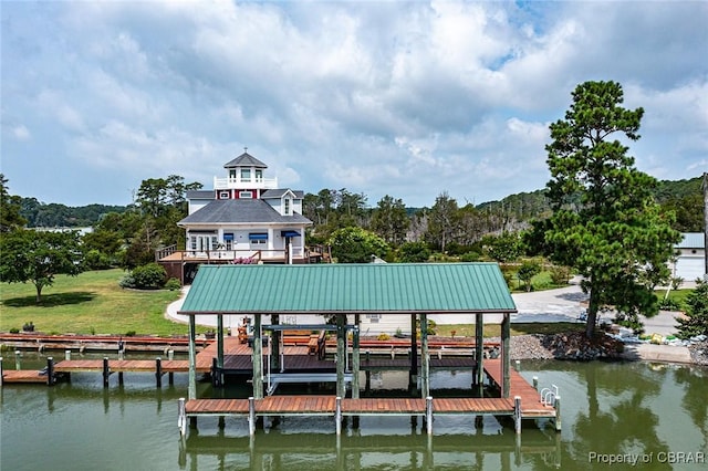 744 Possum Point Rd, Port Haywood, VA 23109 - dock featuring boat lift, a water view, and a lawn