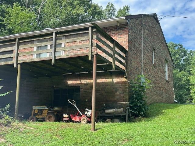 4232 Three Bridge Rd, Powhatan, VA 23139 - back of property with brick siding and a yard