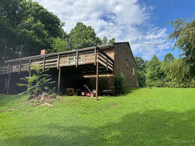4232 Three Bridge Rd, Powhatan, VA 23139 - back of house with a yard, a chimney, and a wooden deck