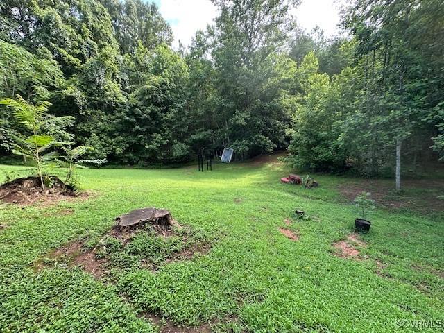 4232 Three Bridge Rd, Powhatan, VA 23139 - view of grassy yard with a wooded view