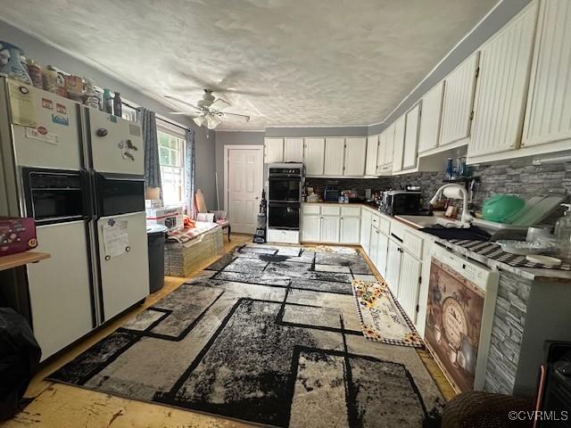 4232 Three Bridge Rd, Powhatan, VA 23139 - kitchen with white refrigerator with ice dispenser, a ceiling fan, white cabinets, and decorative backsplash