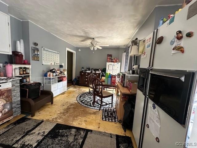 4232 Three Bridge Rd, Powhatan, VA 23139 - kitchen with white fridge with ice dispenser, ceiling fan, and white cabinetry