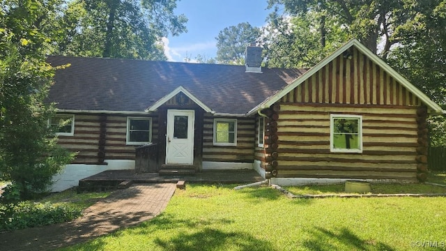 415 Springdale Ave, Colonial Heights, VA 23834 - log-style house featuring log siding, a front lawn, and a chimney