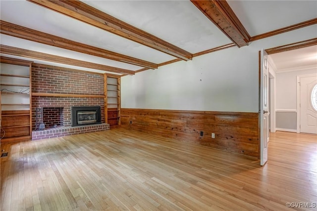 2330 Corner Rock Rd, Midlothian, VA 23113 - unfurnished living room with beamed ceiling, hardwood / wood-style flooring, a fireplace, a wainscoted wall, and crown molding