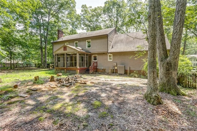 2330 Corner Rock Rd, Midlothian, VA 23113 - rear view of house featuring a sunroom and a chimney