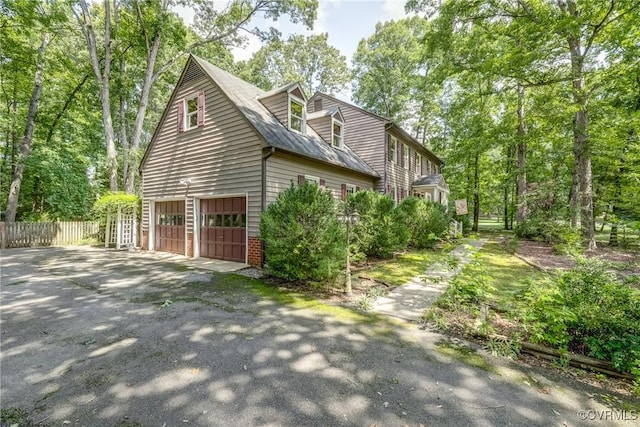 2330 Corner Rock Rd, Midlothian, VA 23113 - view of side of property featuring asphalt driveway and a garage