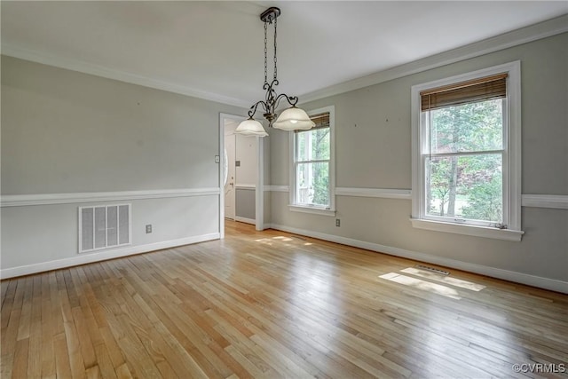 2330 Corner Rock Rd, Midlothian, VA 23113 - unfurnished room featuring crown molding, light wood-type flooring, and a chandelier