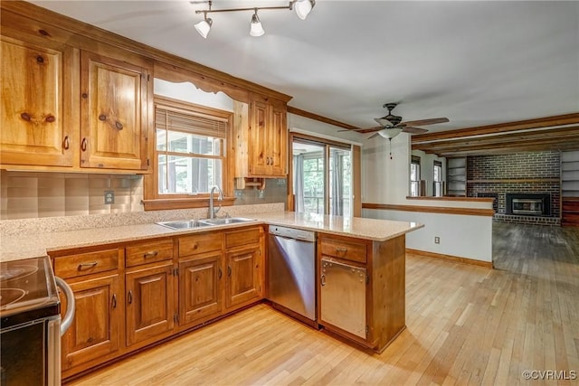 2330 Corner Rock Rd, Midlothian, VA 23113 - kitchen featuring range with electric stovetop, brown cabinetry, a peninsula, and light wood-style floors