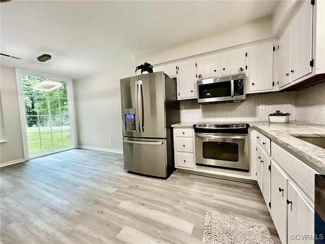 8512 Scottingham Ct, Chesterfield, VA 23236 - kitchen featuring stainless steel appliances, white cabinetry, backsplash, light wood finished floors, and pendant lighting