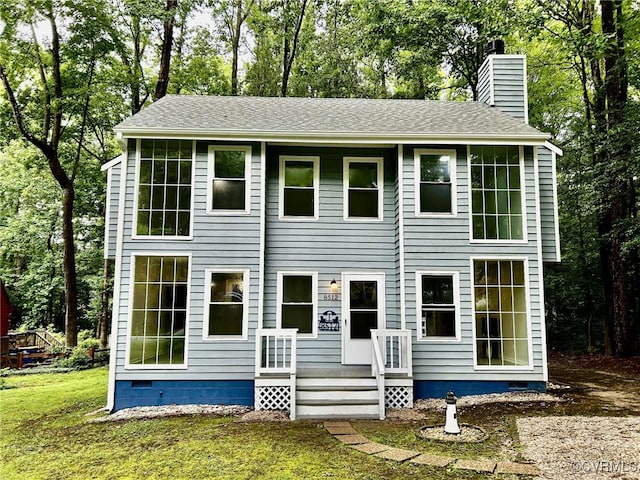 8512 Scottingham Ct, Chesterfield, VA 23236 - view of front of house featuring a chimney, roof with shingles, view of wooded area, and a front yard