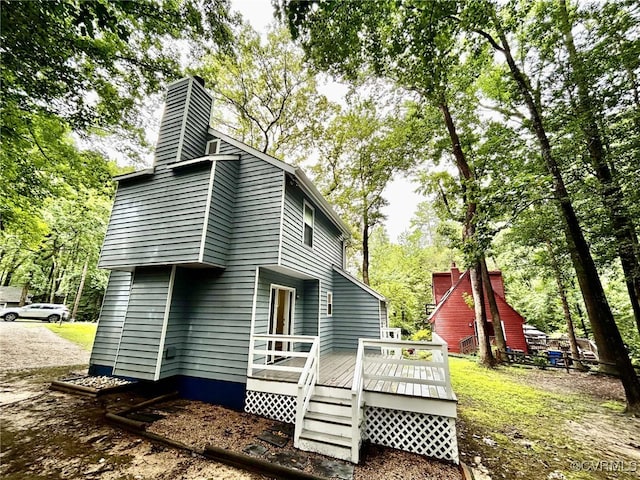 8512 Scottingham Ct, Chesterfield, VA 23236 - back of property featuring a wooden deck, a chimney, and view of scattered trees