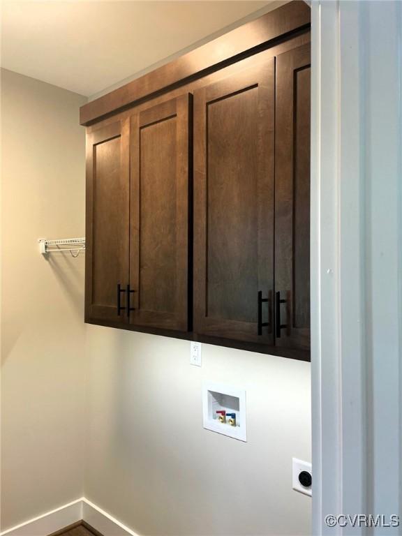 5731 Beechnut Ave, South Chesterfield, VA 23803 - laundry area with cabinet space, washer hookup, and hookup for an electric dryer