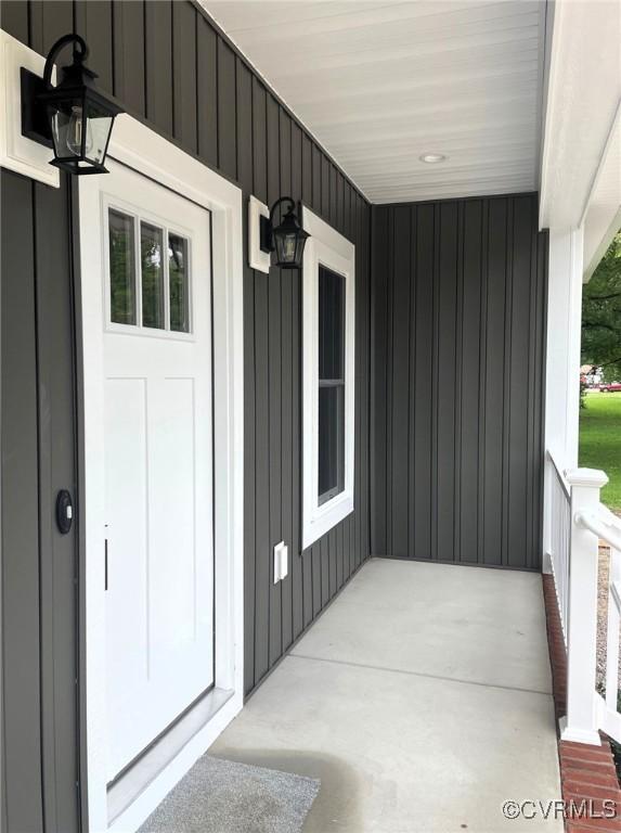 5731 Beechnut Ave, South Chesterfield, VA 23803 - entrance to property with a porch and board and batten siding