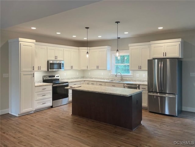 5731 Beechnut Ave, South Chesterfield, VA 23803 - kitchen featuring stainless steel appliances, recessed lighting, dark wood-type flooring, white cabinets, and a kitchen island
