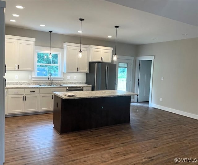 5731 Beechnut Ave, South Chesterfield, VA 23803 - kitchen with freestanding refrigerator, healthy amount of natural light, recessed lighting, dark wood-style floors, and white cabinets