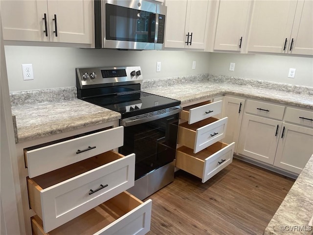 5731 Beechnut Ave, South Chesterfield, VA 23803 - kitchen featuring stainless steel appliances, white cabinets, dark wood-style flooring, and light countertops