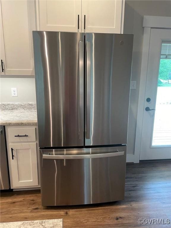 5731 Beechnut Ave, South Chesterfield, VA 23803 - kitchen featuring freestanding refrigerator, white cabinetry, and dark wood-style flooring