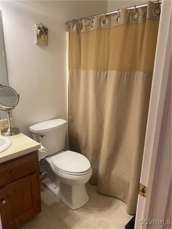 2622 Reba Ct, Glen Allen, VA 23060 - full bath featuring tile patterned flooring, vanity, and curtained shower
