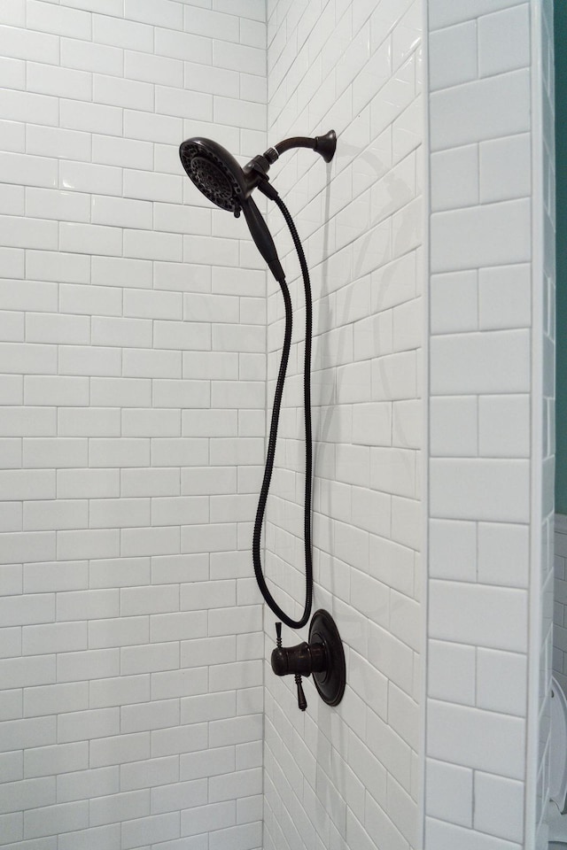 details with a tile shower