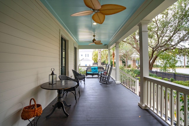 wooden deck with ceiling fan and covered porch