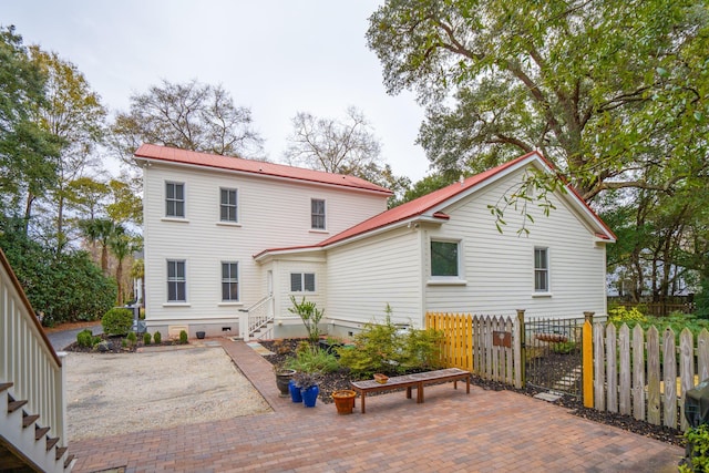 back of property with a patio area