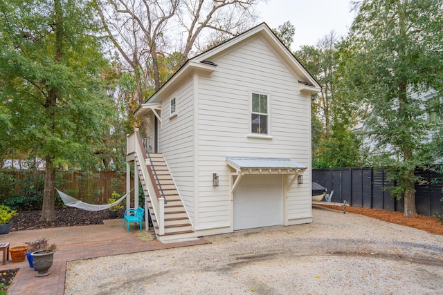 view of property exterior featuring a garage