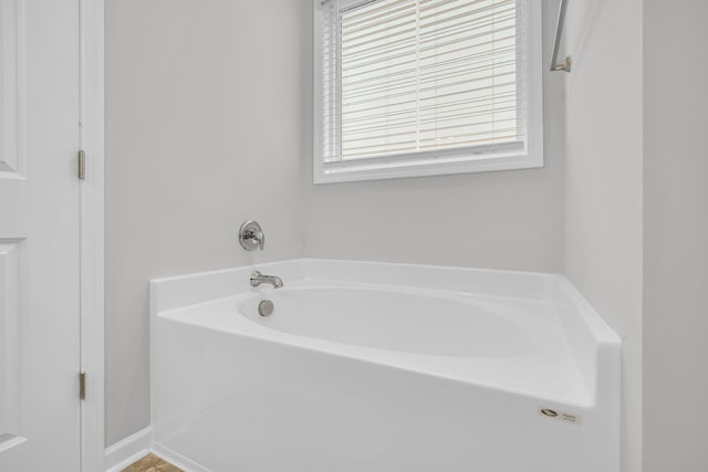bathroom featuring a garden tub