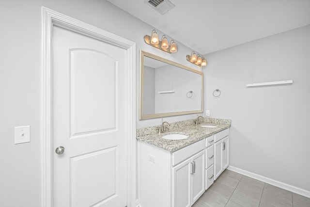 bathroom with vanity and tile patterned flooring