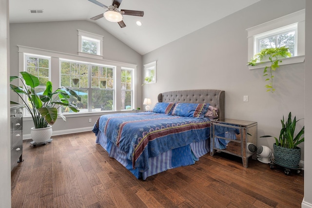 bedroom featuring ceiling fan, lofted ceiling, dark hardwood / wood-style floors, and multiple windows