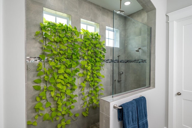 bathroom featuring tiled shower