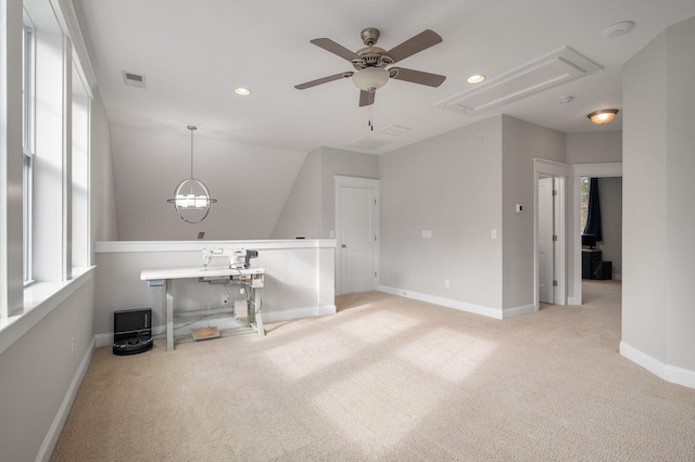 interior space featuring ceiling fan and carpet flooring