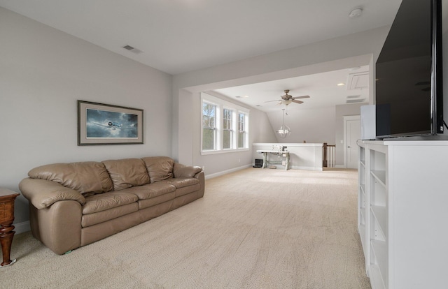 living room featuring light colored carpet and ceiling fan