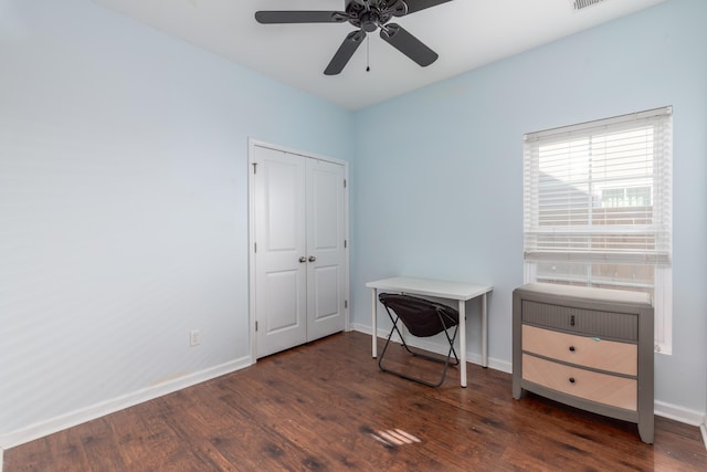 bedroom featuring dark wood-style floors and baseboards